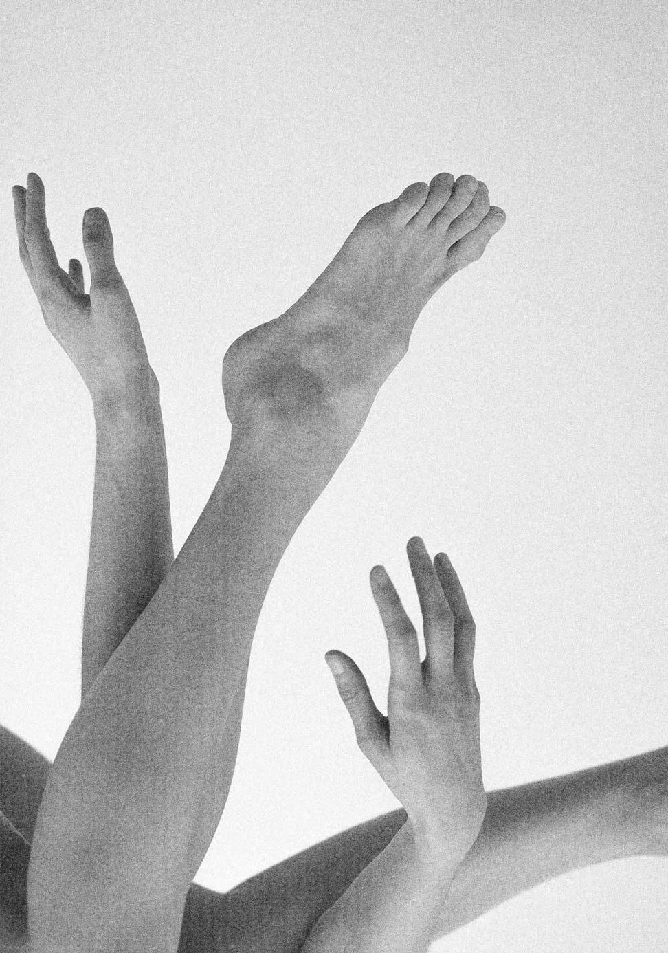 hands and feet in the air black and white