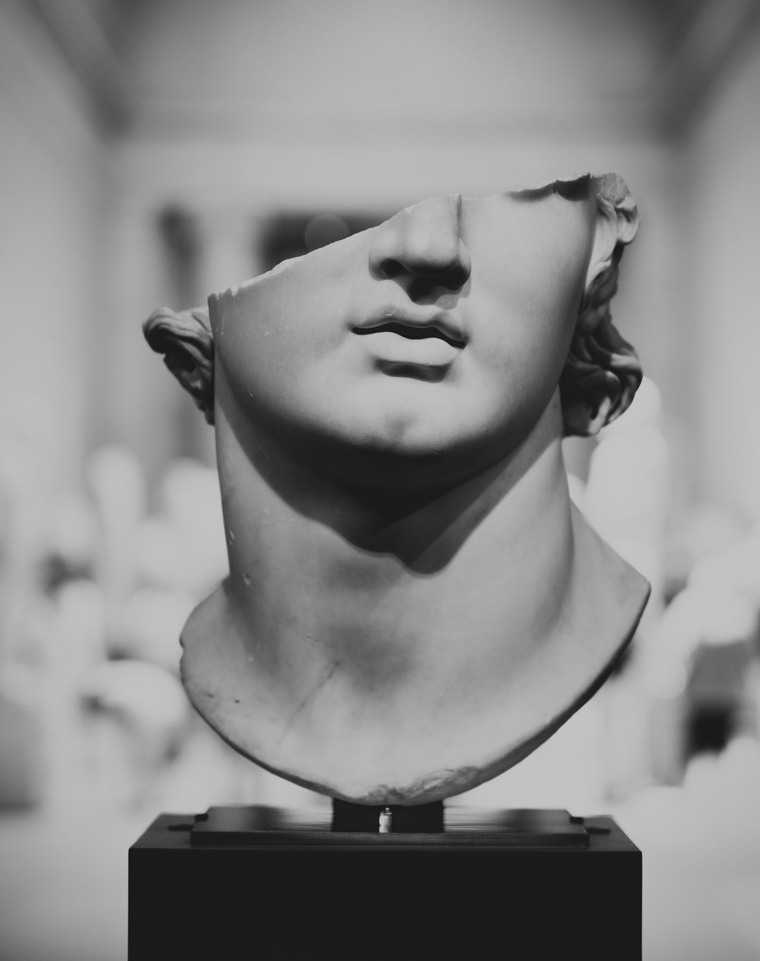 black and white roman statue of mans head